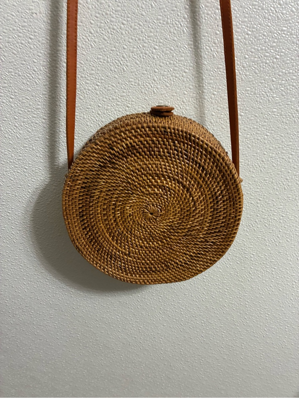 Round Woven RattanCrossbody Bag in Tan with leather strap & snap closure